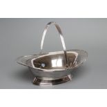 A FRUIT BASKET, maker Elkington, Sheffield 1915, of flared oval form with applied reeded rim and