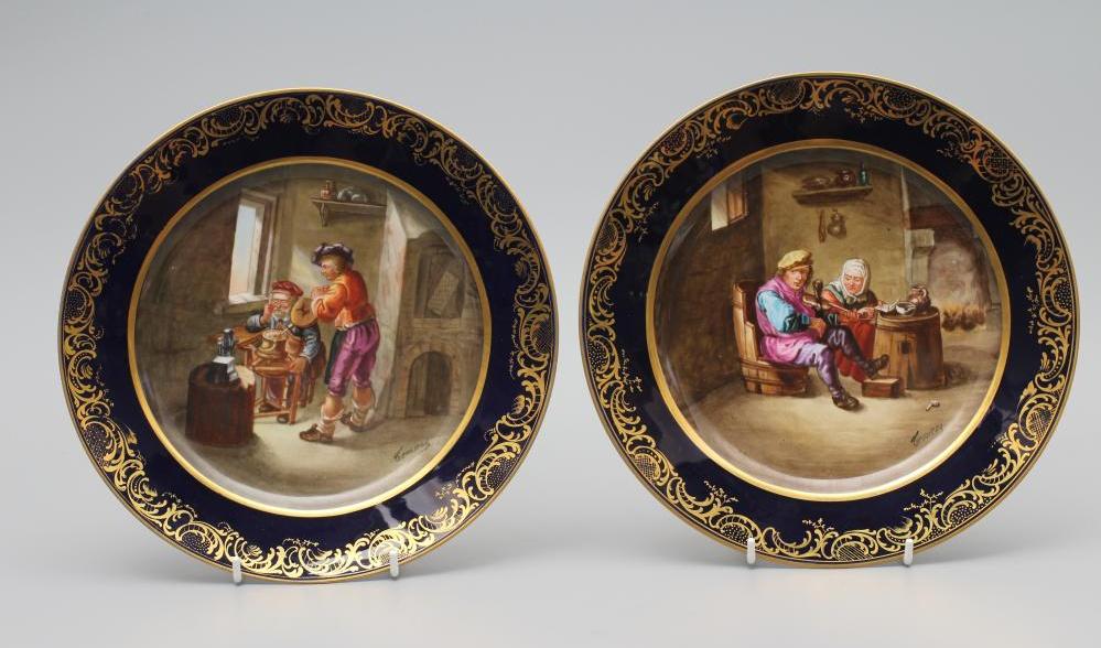 A PAIR OF FRENCH PORCELAIN CABINET PLATES, c.1890, of plain circular form, centrally painted in