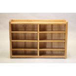 A ROBERT THOMPSON ADZED OAK OPEN BOOKCASE of oblong form with three quarter galleried top, three