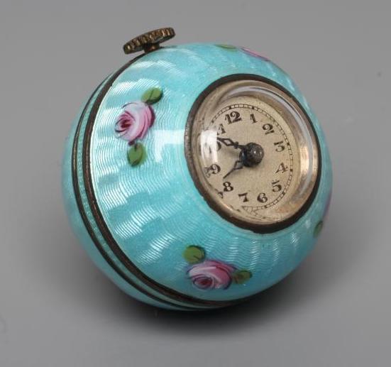 A LADY'S SILVER AND ENAMEL PENDANT BALL WATCH, the silvered dial with black Arabic numerals, the