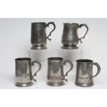 A GROUP OF FIVE PEWTER QUART REEDED MUGS, 19th century, one straight sided, the others of tulip form