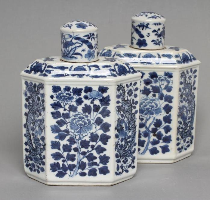 A PAIR OF CHINESE PORCELAIN CANISTERS AND COVERS of canted oblong form, painted in underglaze blue