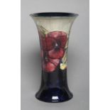 A MOORCROFT POTTERY VASE, early to mid 20th century, of waisted cylindrical form, tubelined and