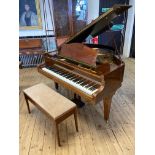 A BECHSTEIN BABY GRAND PIANO, in mahogany case with arched music stand, raised on square tapering