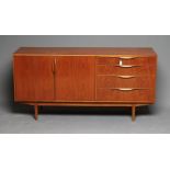 A TEAK LONG SIDEBOARD BY SUTCLIFFE OF TODMORDEN, mid 20th century, comprising four drawers including