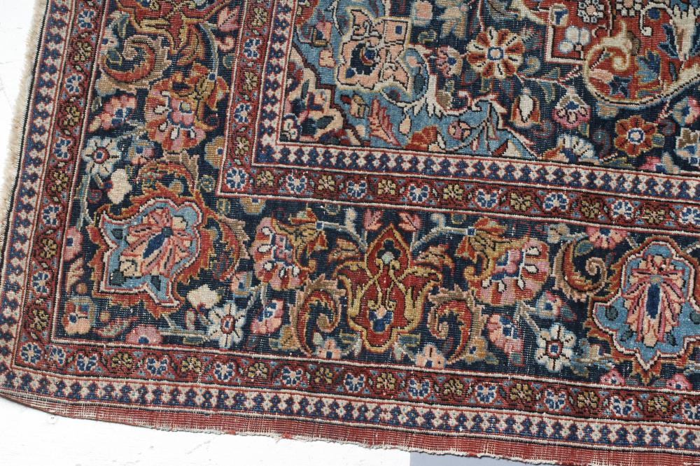A PERSIAN RUG, the red floral field with navy blue and ivory gul, the navy blue main border with - Image 3 of 4