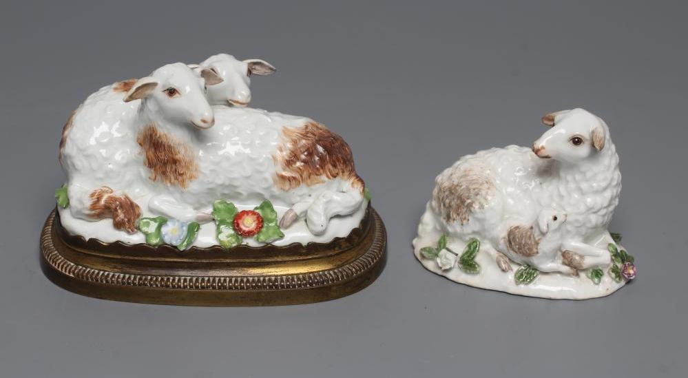 A MEISSEN PORCELAIN GROUP, early 19th century, modelled as two recumbent sheep on a flower encrusted