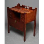 AN EDWARDIAN MAHOGANY BEDSIDE CABINET, c.1900, of shallow oblong form, the tray top with wavy