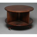 A ROSEWOOD REVOLVING BOOKCASE, mid 20th century, of two tier circular form with turned central