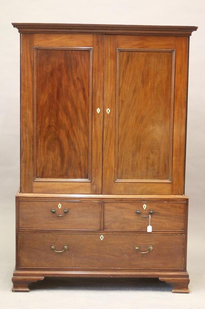 A GEORGIAN MAHOGANY LINEN PRESS, third quarter 18th century, the dentil moulded cornice over two