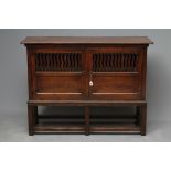 A JOINED OAK LIVERY CUPBOARD, early 18th century and later, the moulded edged top over a pair of