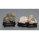 TWO CHINESE JADEITE CARVINGS, one in greenish grey of a horse with a monkey on its back holding a