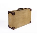 AN HERMES CANVAS AND LEATHER SUITCASE, early 20th century, with stitched and rivetted leather angles