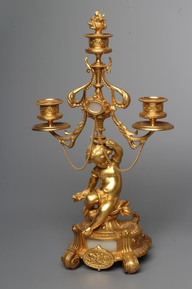 A PAIR OF FRENCH GILT METAL THREE LIGHT FIGURAL CANDELABRA inset with onyx panels, early 20th - Image 2 of 4