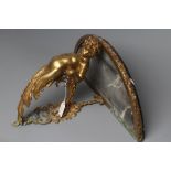 A GILT METAL FIGURAL WALL BRACKET, late 19th century, modelled as a putto supporting a demi-lune