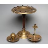 A VICTORIAN BRASS INKWELL of dished circular form, the spherical well with two ring handles on a