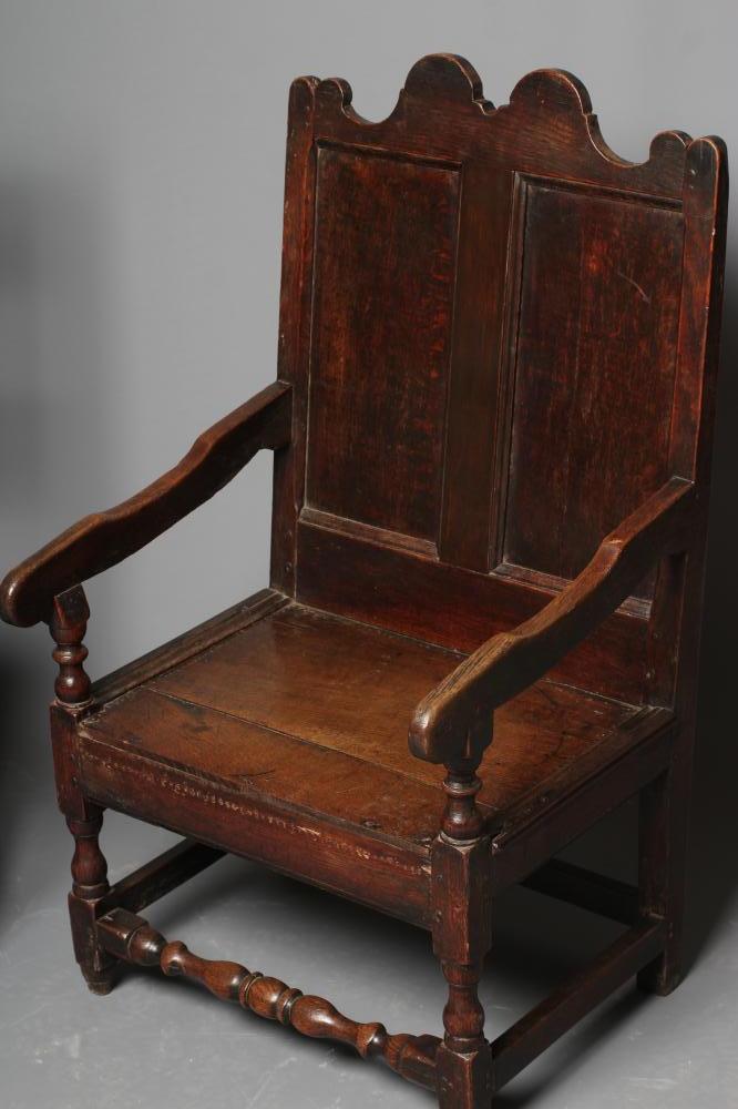 A JOINED OAK ARMCHAIR, early 18th century, the twin panelled back with waved top rail, shaped - Image 4 of 4