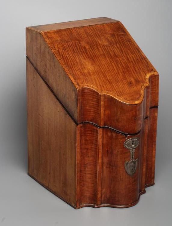 A GEORGIAN MAHOGANY KNIFE BOX, late 18th century, of oblong serpentine form with satinwood banding