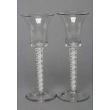 A PAIR OF CORDIAL GLASSES, mid 18th century, the bell bowls on opaque twist stems with a central