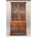 A GEORGIAN MAHOGANY SECRETAIRE BOOKCASE, late 18th century, the moulded cornice over two astragal