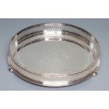 A CIRCULAR GALLERIED TRAY, maker Roberts & Belk, Sheffield 1978, with cast and applied bead rim over