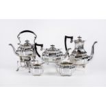 A FOUR PIECE TEA AND COFFEE SERVICE, maker Cooper Bros. & Sons Ltd., Sheffield 1916, of lobed oval