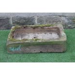 A SANDSTONE TROUGH of well cut oblong form, 30" x 16" x 6 1/2" (Est. plus 24% premium inc. VAT)