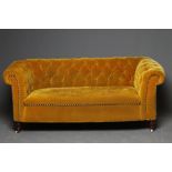 A VICTORIAN WALNUT FRAMED CHESTERFIELD DROP END SETTEE button upholstered in mustard yellow, on