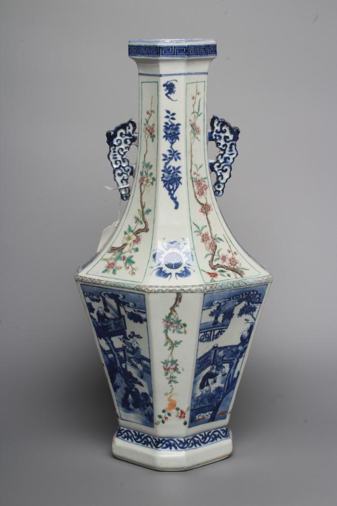 A CHINESE PORCELAIN VASE of swept octagonal form with two scrolling handles, painted in in