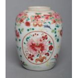 A CHINESE PORCELAIN FAMILLE ROSE JAR of ovoid form painted with roundels of peonies on a scattered