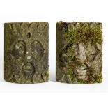 A PAIR OF CARVED SANDSTONE GREEN MAN WALL MASKS, c.1900, of bowed oblong form, realistically
