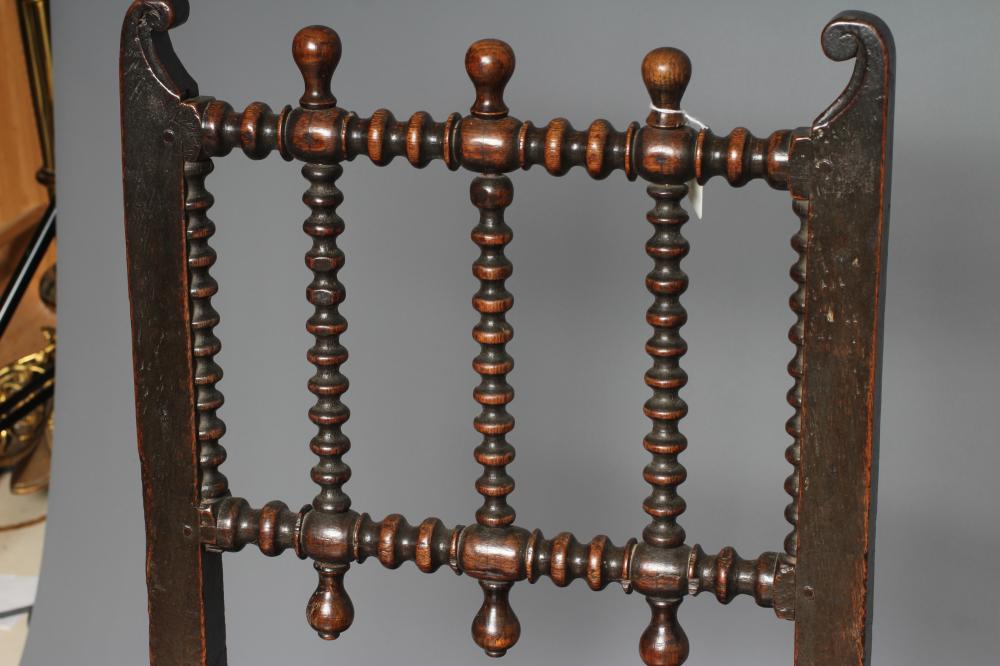 A JOINED OAK ARMCHAIR, early 18th century, the twin panelled back with waved top rail, shaped - Image 3 of 4