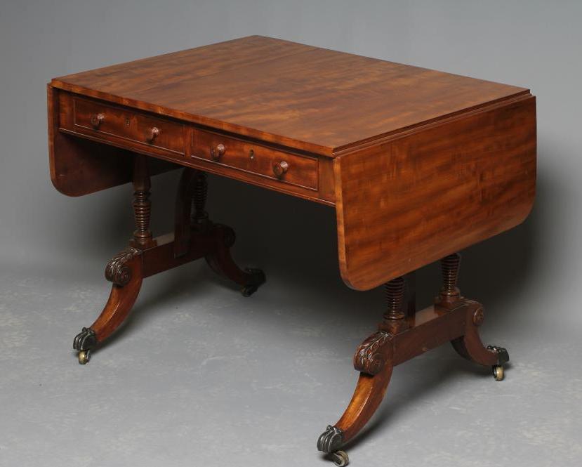 A REGENCY MAHOGANY SOFA TABLE, early 19th century, the rounded oblong top over frieze with two