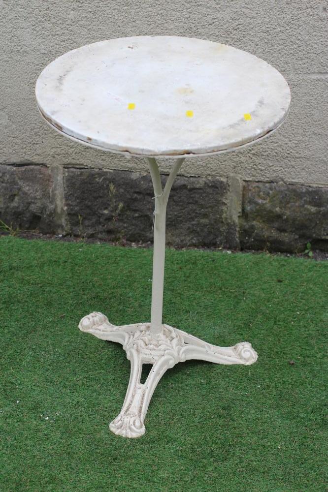 A CAST IRON BISTRO TABLE, the circular white marble top on plain turned stem, raised on scrolled and