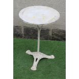 A CAST IRON BISTRO TABLE, the circular white marble top on plain turned stem, raised on scrolled and