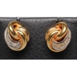 A PAIR OF 18CT BI-COLOUR GOLD KNOT EAR STUDS, each set with two diamond points to the white beaded