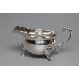 A SAUCEBOAT, maker Roberts & Belk, Sheffield 1944, of bombe circular form with acanthus leaf