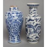 A CHINESE PORCELAIN ROULEAU VASE painted in underglaze blue with two dragons chasing the flaming