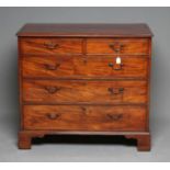 A GEORGIAN MAHOGANY CHEST, late 18th century, the moulded edge and banded top with stringing, two