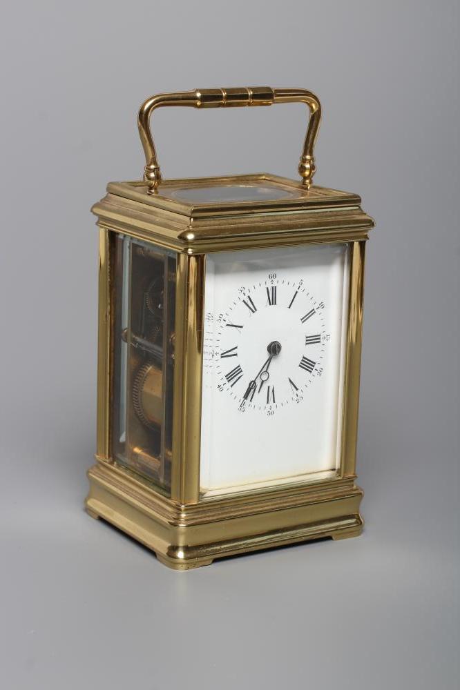 A BRASS CASED CARRIAGE CLOCK, the twin barrel movement with platform escapement striking on a