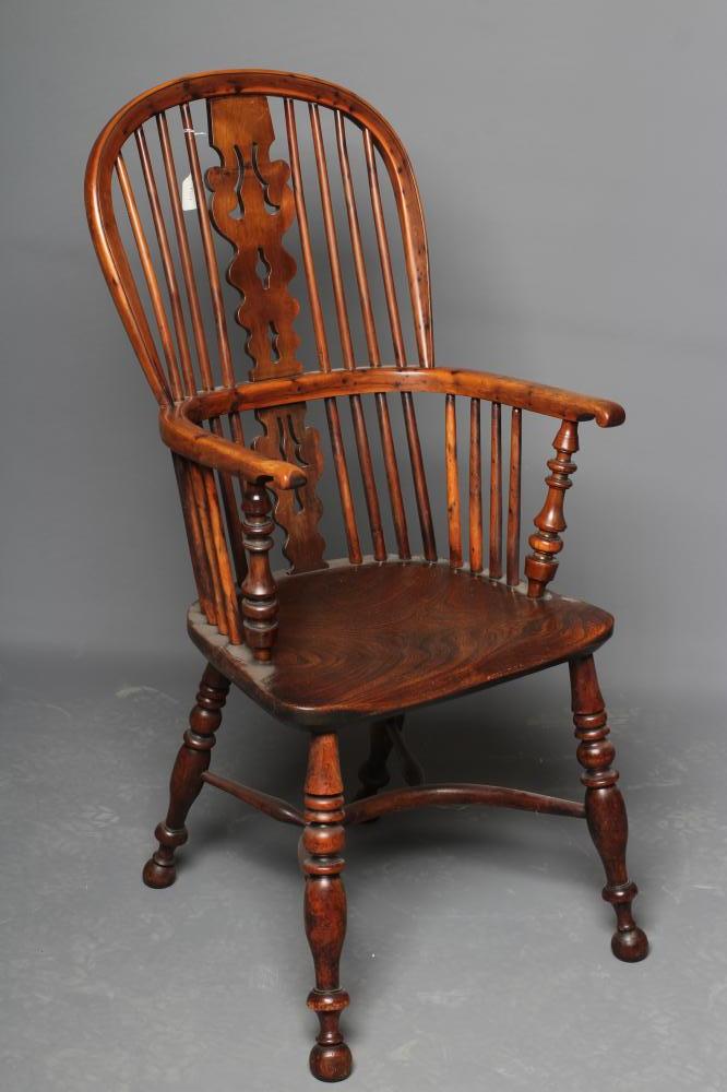 A YORKSHIRE YEW HIGH BACK WINDSOR ARMCHAIR, late 19th century, the hooped back with shaped and