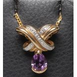 AN AMETHYST AND DIAMOND PENDANT, the oval facet cut amethyst line set below a bi-colour gold