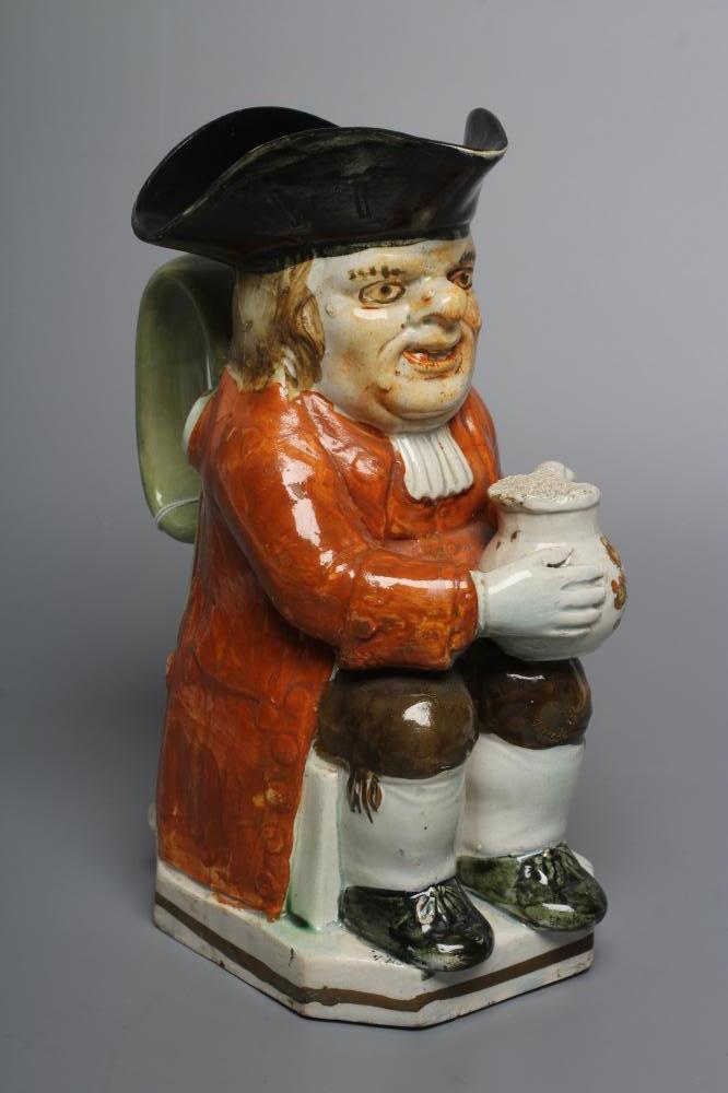 A PEARLWARE "WARTY FACE" TOBY JUG, c.1790, wearing a black tricorn hat, slight ochre colouring to