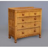 A ROBERT THOMPSON ADZED OAK CHEST, the moulded edged canted oblong top with ledge back, two short