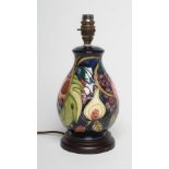 A MOORCROFT POTTERY LAMP BASE, modern, of ovoid form, tubelined and painted in colours with the