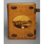 A VICTORIAN MAUCHLINE WARE PHOTOGRAPH ALBUM, made of wood grown on the lands of Abbotsford, the