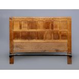 A ROBERT THOMPSON ADZED OAK DOUBLE BEDSTEAD, the multi-panelled headboard with half penny moulded