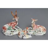 A DERBY PORCELAIN STAG AND HIND, c.1760, each modelled recumbent on a flower encrusted shaped