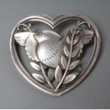 A GEORG JENSEN SILVER HEART SHAPED BROOCH designed by Arno Malinowski with a dove and olive