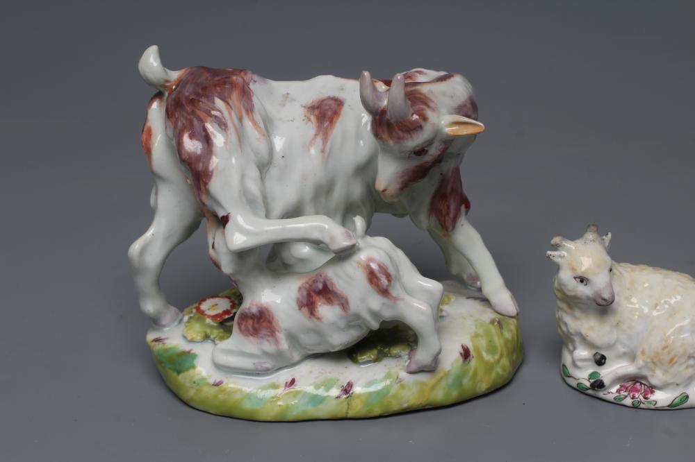 A SMALL BOW PORCELAIN SHEEP, c.1755, modelled recumbent with pale yellow fleece, on a flower painted - Image 2 of 3